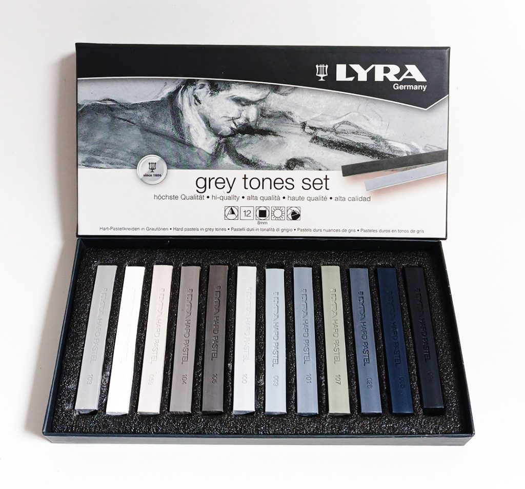 Tiza Pastel Graso 12 colores en tono Gris Polycrayons LYRA 5641122 caja de cartón